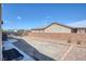 Wide gravel driveway leads to a gated entrance, offering ample parking at 171 Weeping Willow Ct, Pahrump, NV 89048