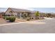 A warm-toned single story home with desert landscaping and a three-car garage at 171 Weeping Willow Ct, Pahrump, NV 89048