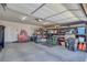 Spacious two-car garage featuring ample storage with shelving units and overhead lighting at 171 Weeping Willow Ct, Pahrump, NV 89048