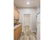 Walk-in pantry features wooden cabinets, granite countertops, and wood-look tile floors for easy cleaning at 171 Weeping Willow Ct, Pahrump, NV 89048