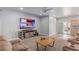 Comfortable living area with neutral colors, a ceiling fan, and an adjoining kitchen at 171 Weeping Willow Ct, Pahrump, NV 89048