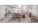 Spacious living room featuring hardwood-style flooring, neutral walls, and an open floor plan at 171 Weeping Willow Ct, Pahrump, NV 89048