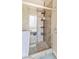 Elegant tiled shower with glass door and shelving, offering a luxurious and convenient bathing experience at 171 Weeping Willow Ct, Pahrump, NV 89048