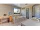 Relaxing bathroom featuring a soaking tub, vanity, and walk-in shower at 1818 Waldman Ave, Las Vegas, NV 89102