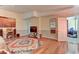 Spacious bedroom featuring a colorful rug, hardwood floors, and a large mirror at 1818 Waldman Ave, Las Vegas, NV 89102