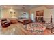 Bright bedroom with a ceiling fan, painting, hardwood flooring, and comfortable furnishings at 1818 Waldman Ave, Las Vegas, NV 89102