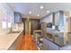 A well-equipped kitchen with an island, stainless steel appliances and recessed lighting at 1818 Waldman Ave, Las Vegas, NV 89102