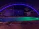 Backyard pool with blue lights, truck parked nearby under metal arch at 1818 Waldman Ave, Las Vegas, NV 89102