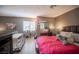 Bedroom showcasing a bed, window with blinds, and closet, with a gray and pink color scheme at 1843 Mimosa Ct, Henderson, NV 89014