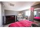 Cozy bedroom with wood floors, dresser, and a view from the window at 1843 Mimosa Ct, Henderson, NV 89014