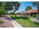 View of condo community showcasing mature landscaping, walkway, and well-maintained grounds at 1843 Mimosa Ct, Henderson, NV 89014