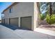 Home exterior featuring attached garages and tile roof at 1843 Mimosa Ct, Henderson, NV 89014
