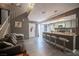 Inviting living area with kitchen access, laminate floors, and a staircase to the upper level at 1843 Mimosa Ct, Henderson, NV 89014