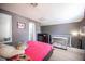 Spacious bedroom with a queen-size bed, laminate floors, and an en-suite bathroom at 1843 Mimosa Ct, Henderson, NV 89014
