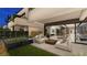 Inviting outdoor space with modern furniture, fire features, green lawn, and seamless indoor-outdoor living at 20 Lakefront Dr, Henderson, NV 89011