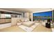 Serene main bedroom with a cozy bed, minimalist decor, an en-suite bathroom, and a balcony with waterfront views at 20 Lakefront Dr, Henderson, NV 89011