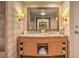 Bright bathroom features a double vanity and a decorative mirror reflecting marble countertops at 2000 Fashion Show Dr # 4105-4106, Las Vegas, NV 89109