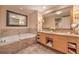 Elegant bathroom with double vanity, large mirrors, and soaking tub at 2000 Fashion Show Dr # 4105-4106, Las Vegas, NV 89109