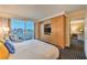 Spacious bedroom features a large window with city views, wardrobe, and a king-sized bed at 2000 Fashion Show Dr # 4105-4106, Las Vegas, NV 89109