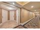 Well-lit hallway showcasing the entrance to a suite, highlighting neutral tones and elegant design at 2000 Fashion Show Dr # 4105-4106, Las Vegas, NV 89109