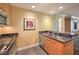 Features of the kitchen include a cooktop, microwave, countertops, and stainless steel sink at 2000 Fashion Show Dr # 4105-4106, Las Vegas, NV 89109