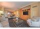 Open concept living space with comfortable seating, a large TV, and a view of the kitchen area at 2000 Fashion Show Dr # 4105-4106, Las Vegas, NV 89109