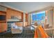 Bright living room with full kitchen, comfortable seating, and expansive windows offering incredible views at 2000 Fashion Show Dr # 4105-4106, Las Vegas, NV 89109