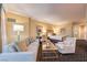 Open living room and bedroom area featuring modern furniture, carpet and natural light at 2000 Fashion Show Dr # 4105-4106, Las Vegas, NV 89109