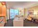 Open living room area featuring modern furniture, city views and natural light at 2000 Fashion Show Dr # 4105-4106, Las Vegas, NV 89109
