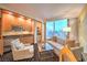 Bright living room featuring a sofa, armchair, and built-in kitchenette area with scenic city views at 2000 Fashion Show Dr # 4105-4106, Las Vegas, NV 89109