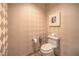 Neutral powder room with attractive diamond pattern wallpaper at 2000 Fashion Show Dr # 4105-4106, Las Vegas, NV 89109