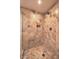 Walk-in shower featuring stunning marble tiling, a rainfall shower head, and built in storage at 2000 Fashion Show Dr # 4105-4106, Las Vegas, NV 89109