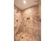 Elegant marble tile shower with dual shower heads and corner shelving for toiletries at 2000 Fashion Show Dr # 4105-4106, Las Vegas, NV 89109