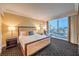 Relaxing bedroom featuring a king bed, cityscape views, and stylish furnishings at 2000 Fashion Show Dr # 4106, Las Vegas, NV 89109