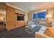 Inviting living room featuring cozy seating, modern entertainment center, and stunning city views at 2000 Fashion Show Dr # 4106, Las Vegas, NV 89109