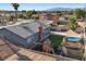 An aerial view features a backyard with a pool, patio, and play structure, offering a versatile outdoor space at 2088 Miner Way, Las Vegas, NV 89104