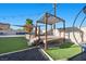 A backyard oasis awaits, featuring a covered deck, built-in seating, and a pool for ultimate relaxation and enjoyment at 2088 Miner Way, Las Vegas, NV 89104