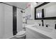 Nicely updated bathroom features a shower with modern black and white tile accents at 2088 Miner Way, Las Vegas, NV 89104