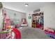 Playful bedroom features a play kitchen, dress-up station, and ample toy storage at 2088 Miner Way, Las Vegas, NV 89104