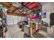 A spacious garage with ceiling racks and shelving, perfect for storing vehicles and organizing tools and equipment at 2088 Miner Way, Las Vegas, NV 89104