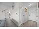 Hallway features neutral paint, wood-look floors, and decorative wall art in a brightly lit entry space at 2088 Miner Way, Las Vegas, NV 89104