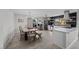 Open kitchen with stainless steel appliances, island, updated cabinets, and adjacent dining space for entertaining at 2088 Miner Way, Las Vegas, NV 89104