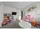 Large playroom with toys, a TV, and space for activities and creative play at 2088 Miner Way, Las Vegas, NV 89104