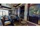 Full wet bar area with a marble countertop, liquor storage, a beverage refrigerator and a long bar at 211 E Flamingo Rd # 202, Las Vegas, NV 89169