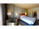 Cozy bedroom featuring a comfortable queen bed and soft lighting at 211 E Flamingo Rd # 202, Las Vegas, NV 89169