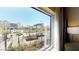Bright, expansive city view from a hotel window with palm trees at 211 E Flamingo Rd # 202, Las Vegas, NV 89169