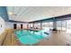 Indoor pool area with tables and chairs for relaxing at 211 E Flamingo Rd # 202, Las Vegas, NV 89169