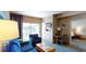 Comfortable living area with a balcony offering city views and access to the adjacent bedroom at 211 E Flamingo Rd # 202, Las Vegas, NV 89169
