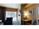 Comfortable living area with city view balcony and an open doorway leading to the bedroom at 211 E Flamingo Rd # 202, Las Vegas, NV 89169