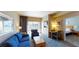 Cozy living area with city view balcony access and an open doorway to the bedroom at 211 E Flamingo Rd # 202, Las Vegas, NV 89169